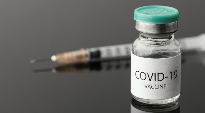 covid vaccine vial and syringe